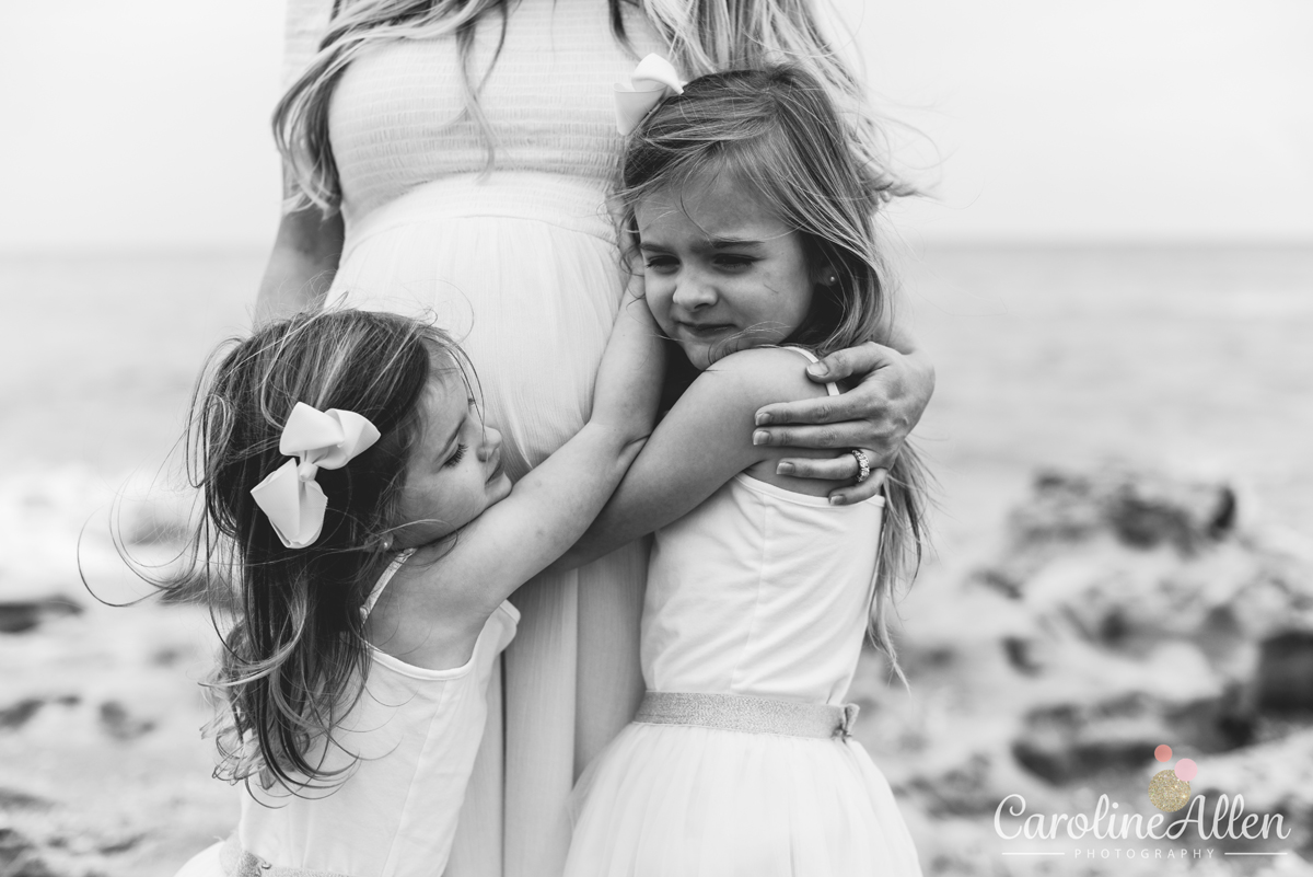 sisters, black and white, hugging