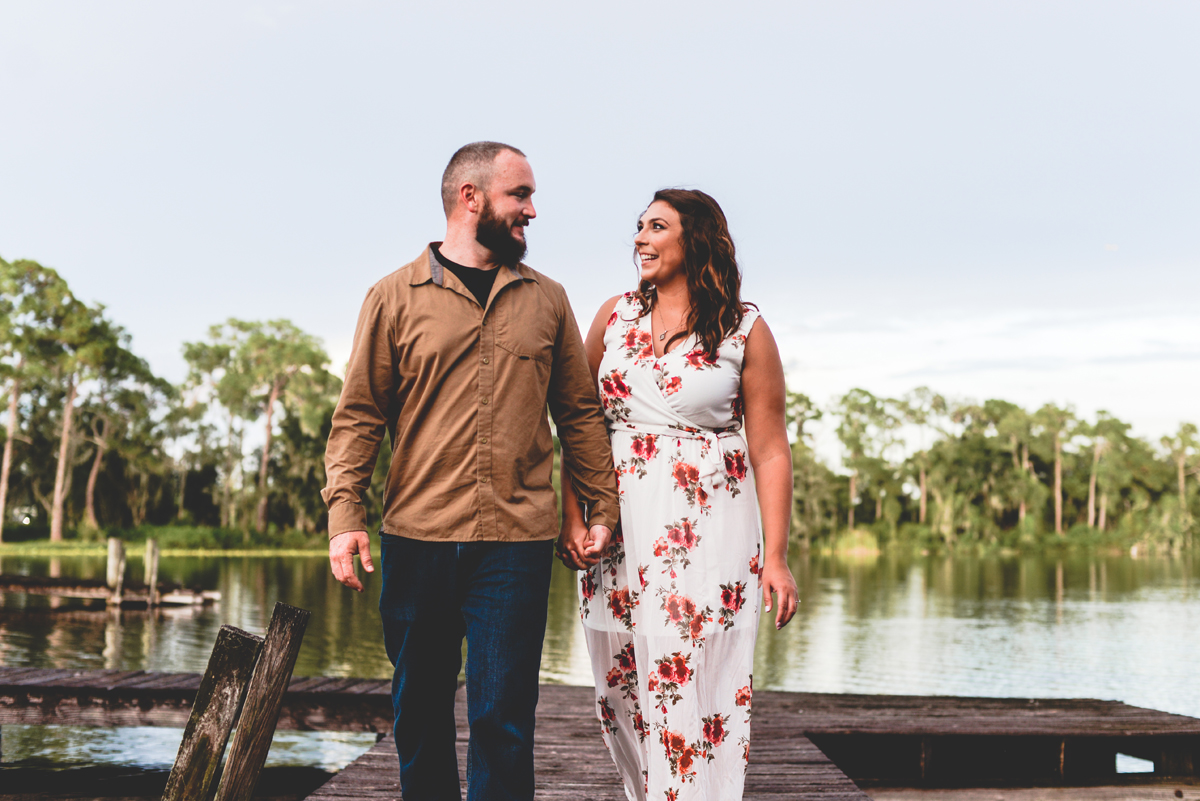 couple, holding hands, walking, dock, lake