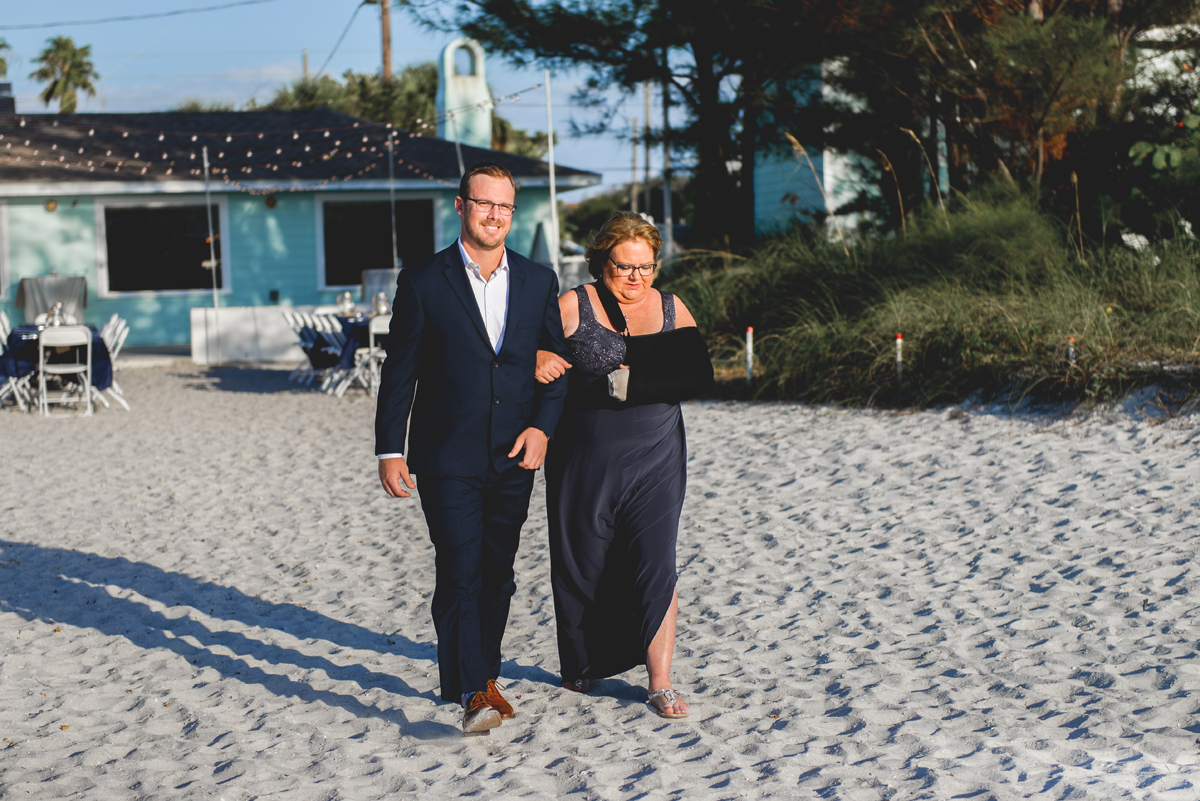 groom, mother of the groom, beach, wedding, walking, family