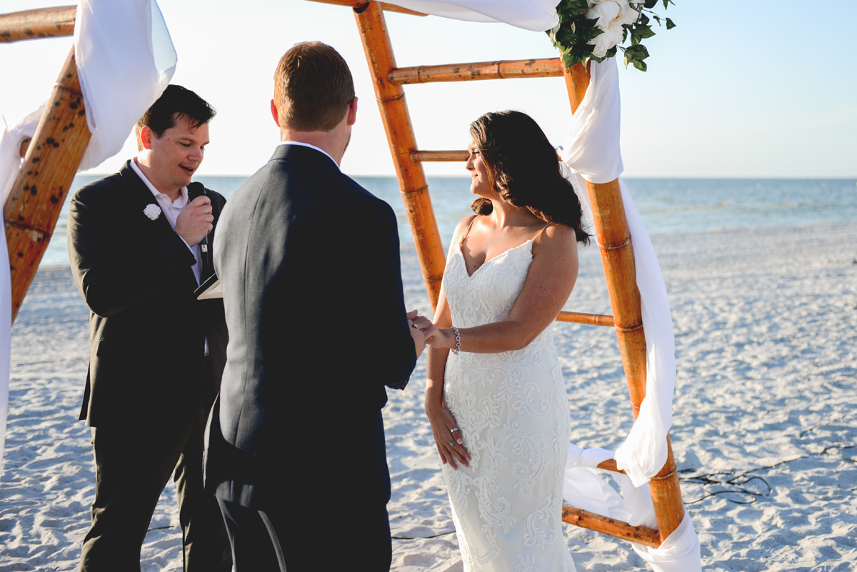 bride, groom, wedding rings, beach, ocean
