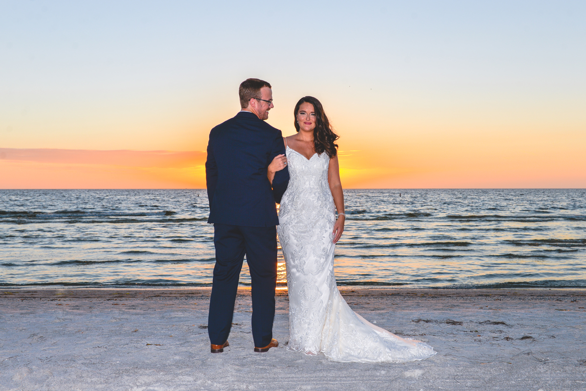 smiling, bride, groom, just married, sunset, ocean, beach