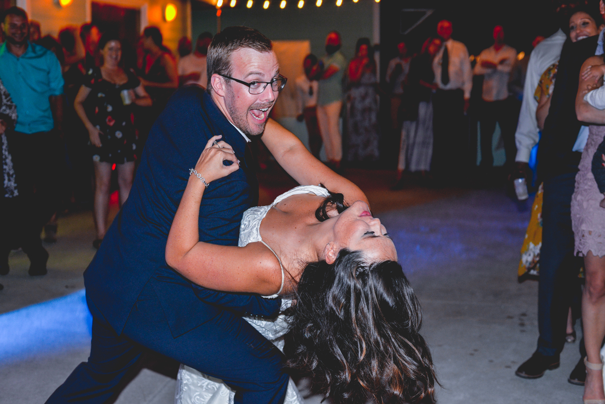 dip, first dance, lights, bride, groom