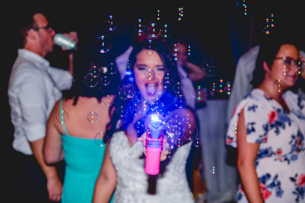 bride, bubbles, bubble gun, blue light, party, wedding
