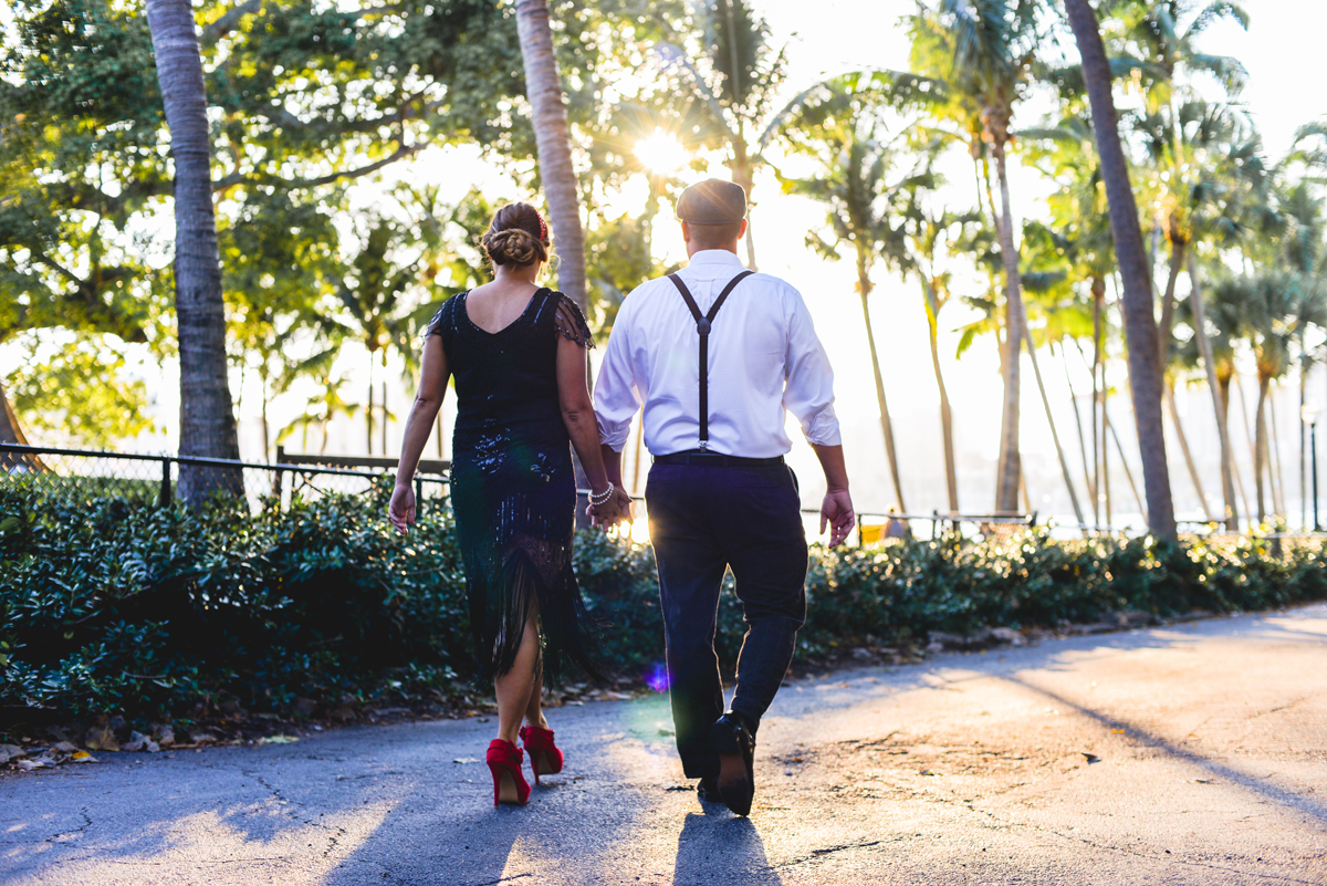 holding hands, walking, suspenders, palm trees, sunset