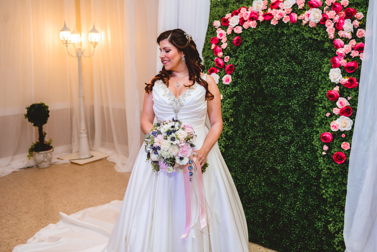 bride, wedding dress, greenery, flowers, lamp