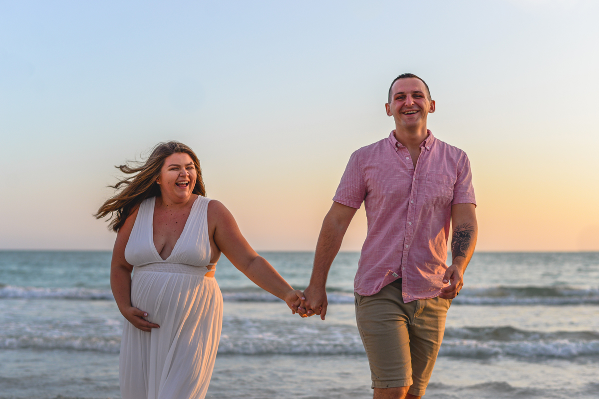 couple, laughing, holding hands, sunset, ocean