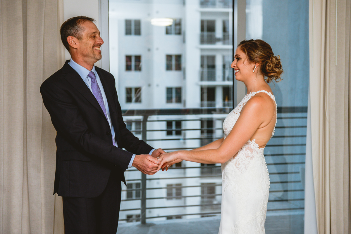 wedding, first look, holding hands, city