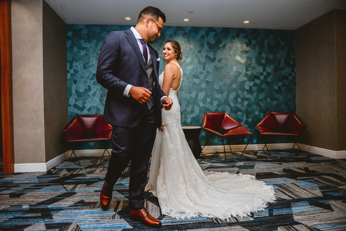 first look, bride, groom, hotel, wedding, walking