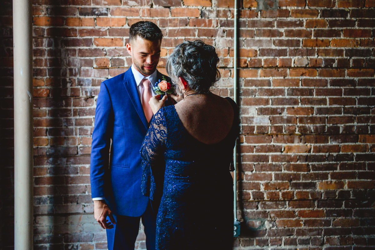 groom, mother, boutonniere, brick