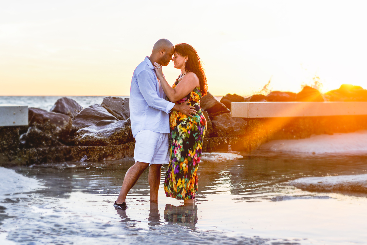 water, couple, sunset, sun flare, ocean