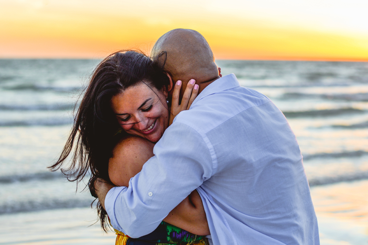 couple, laughing, kissing, hugging, ocean, water, sunset