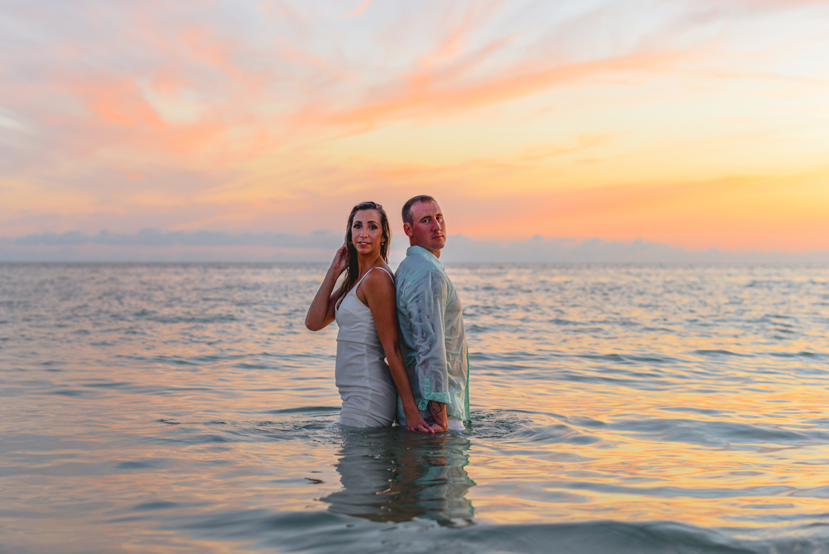 water, sunset, couple, holding hands, skyline