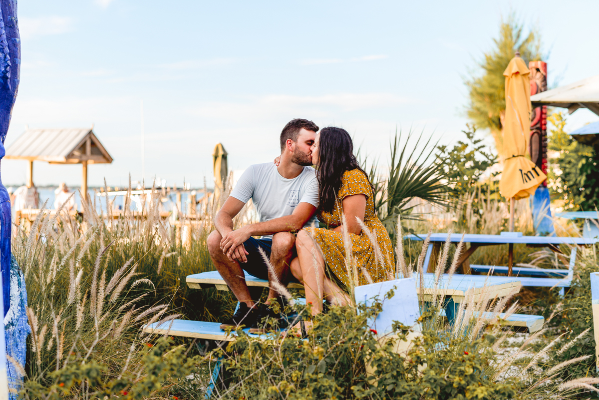 tropical, beach, couple, sitting, kissing, Tampa engagement