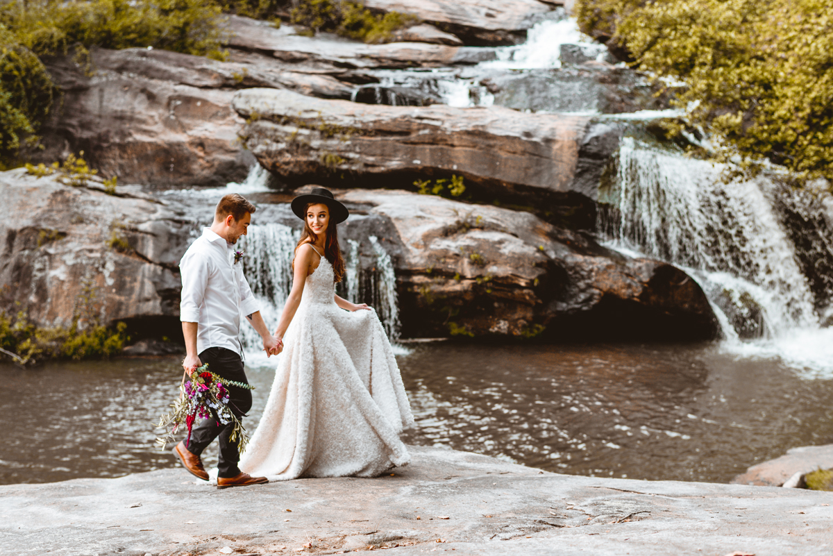 holding hands, walking, waterfall, south Carolina, bride, groom